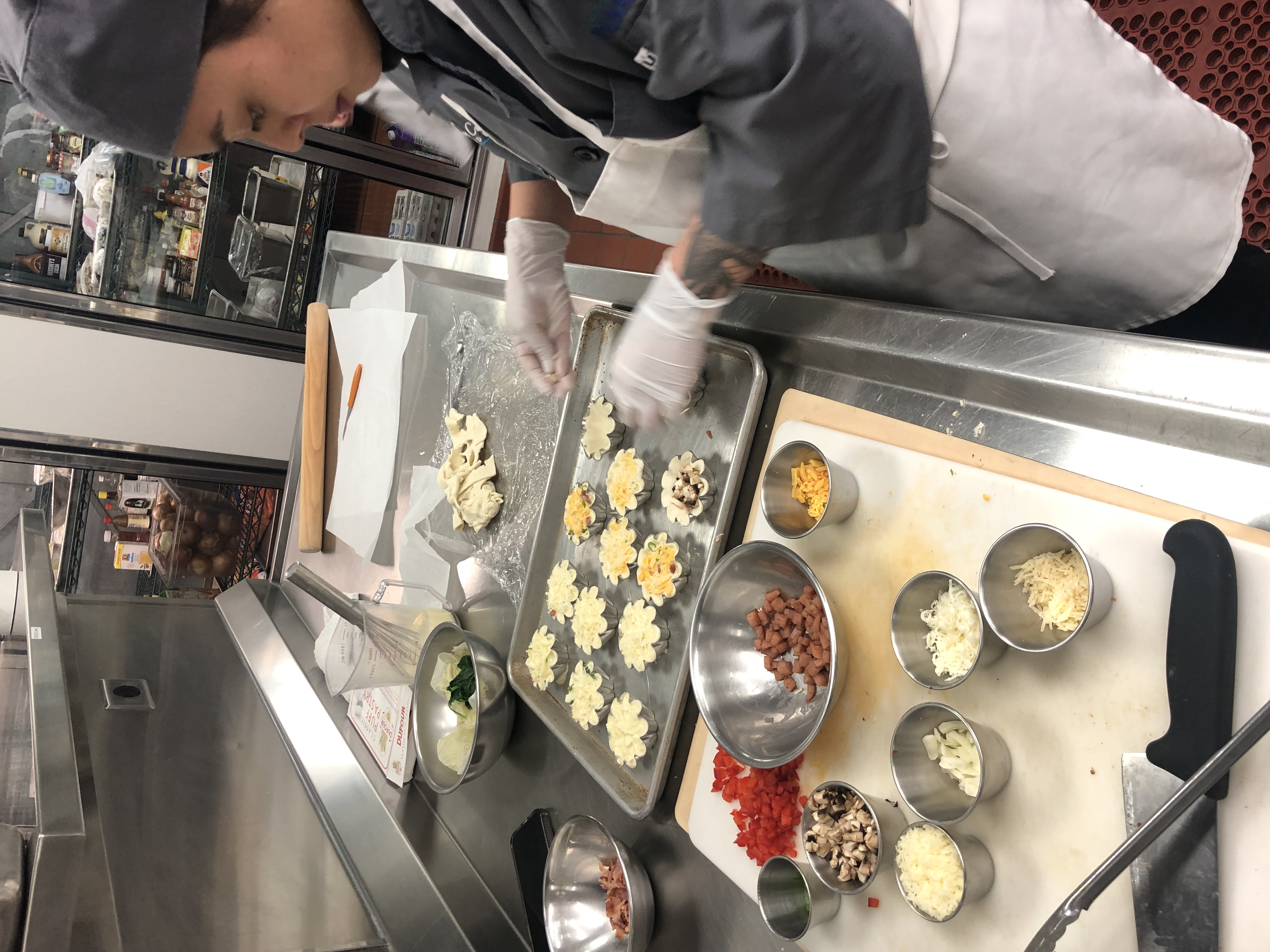 Culinary arts student preparing food in the kitchen