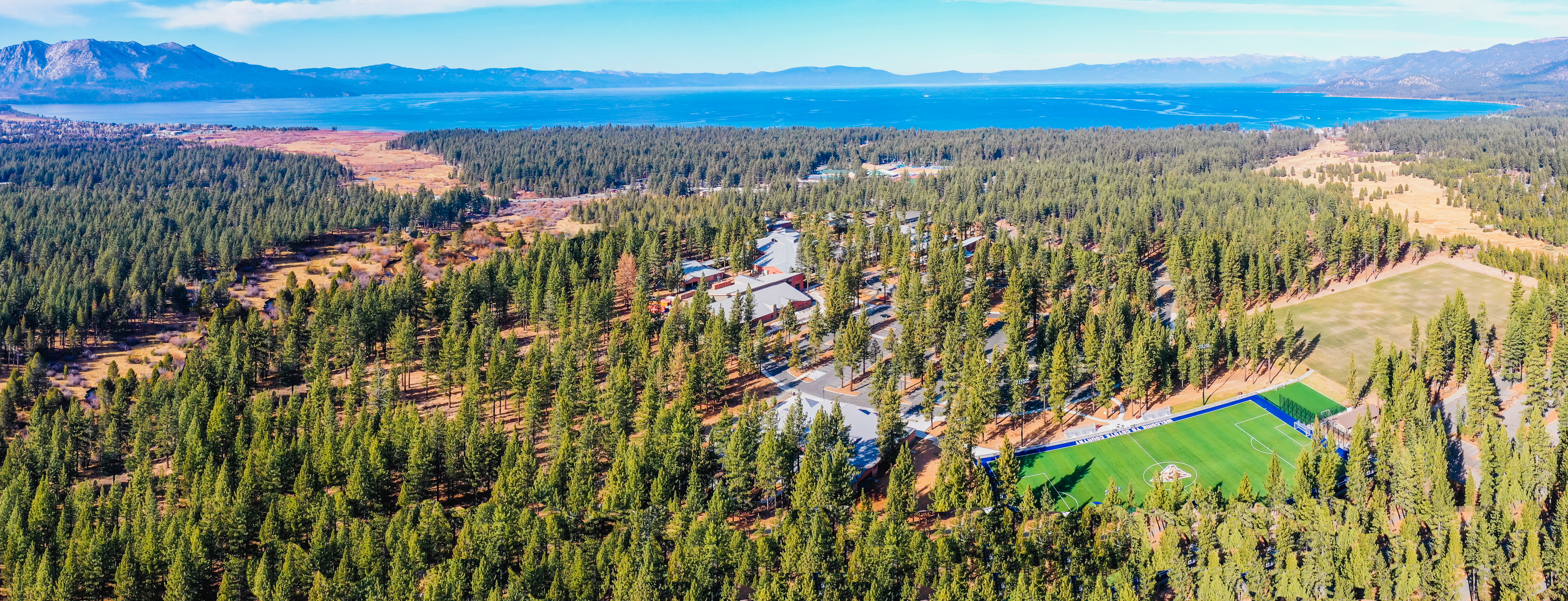 drone photo of campus and Lake Tahoe