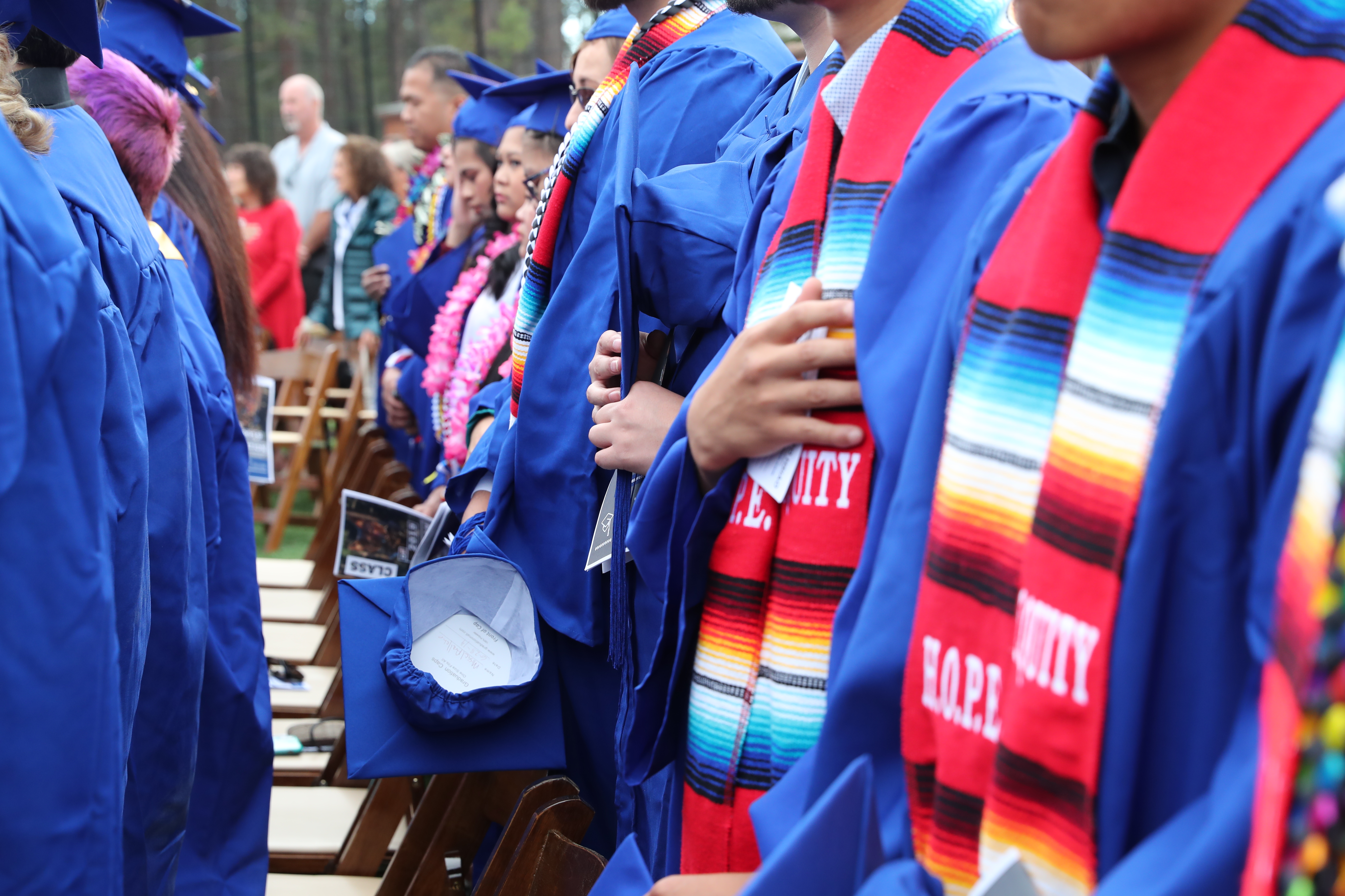 LTCC graduates standing at Commencement ceremony