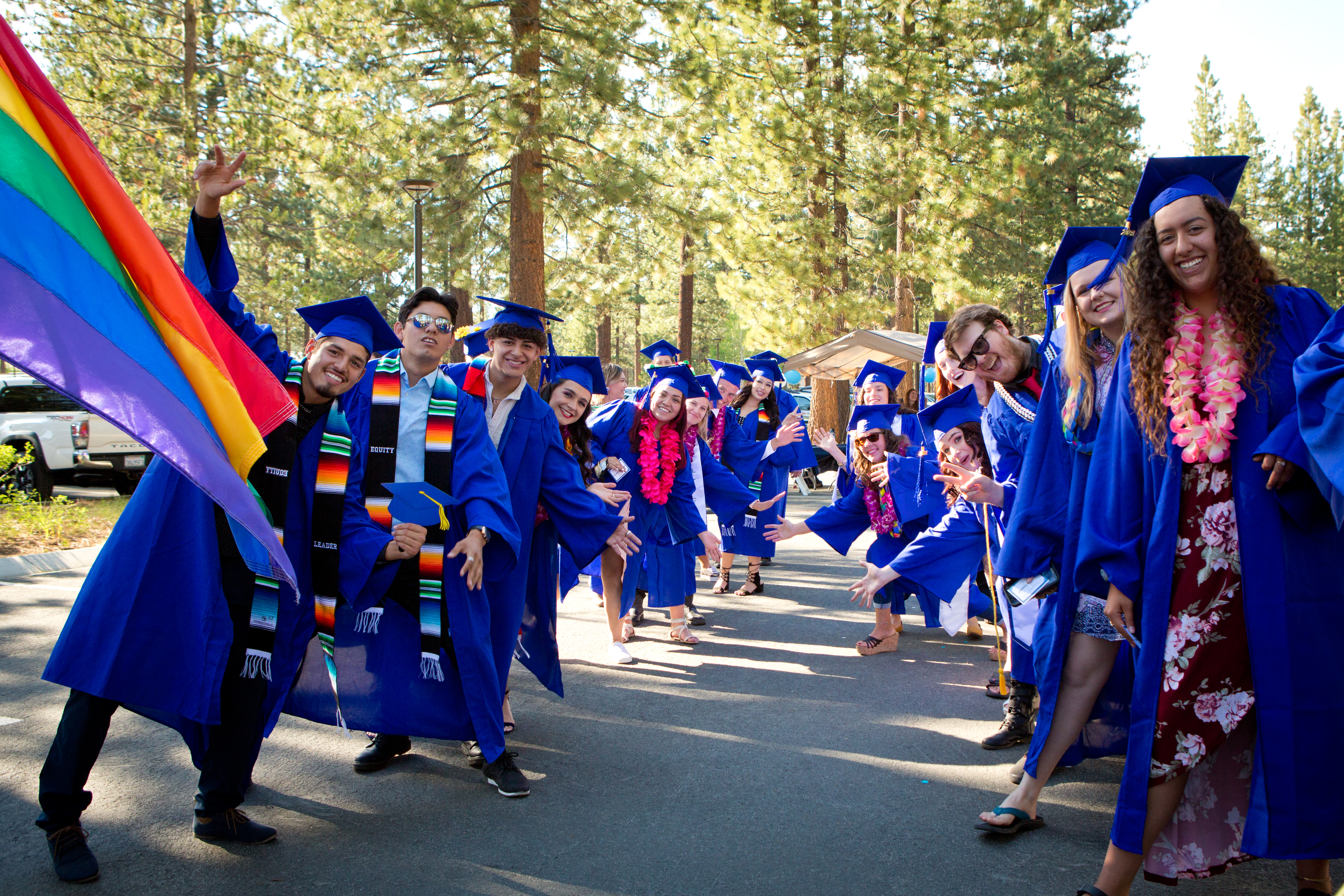 LTCC graduates with a pride flag at Commencement 2021