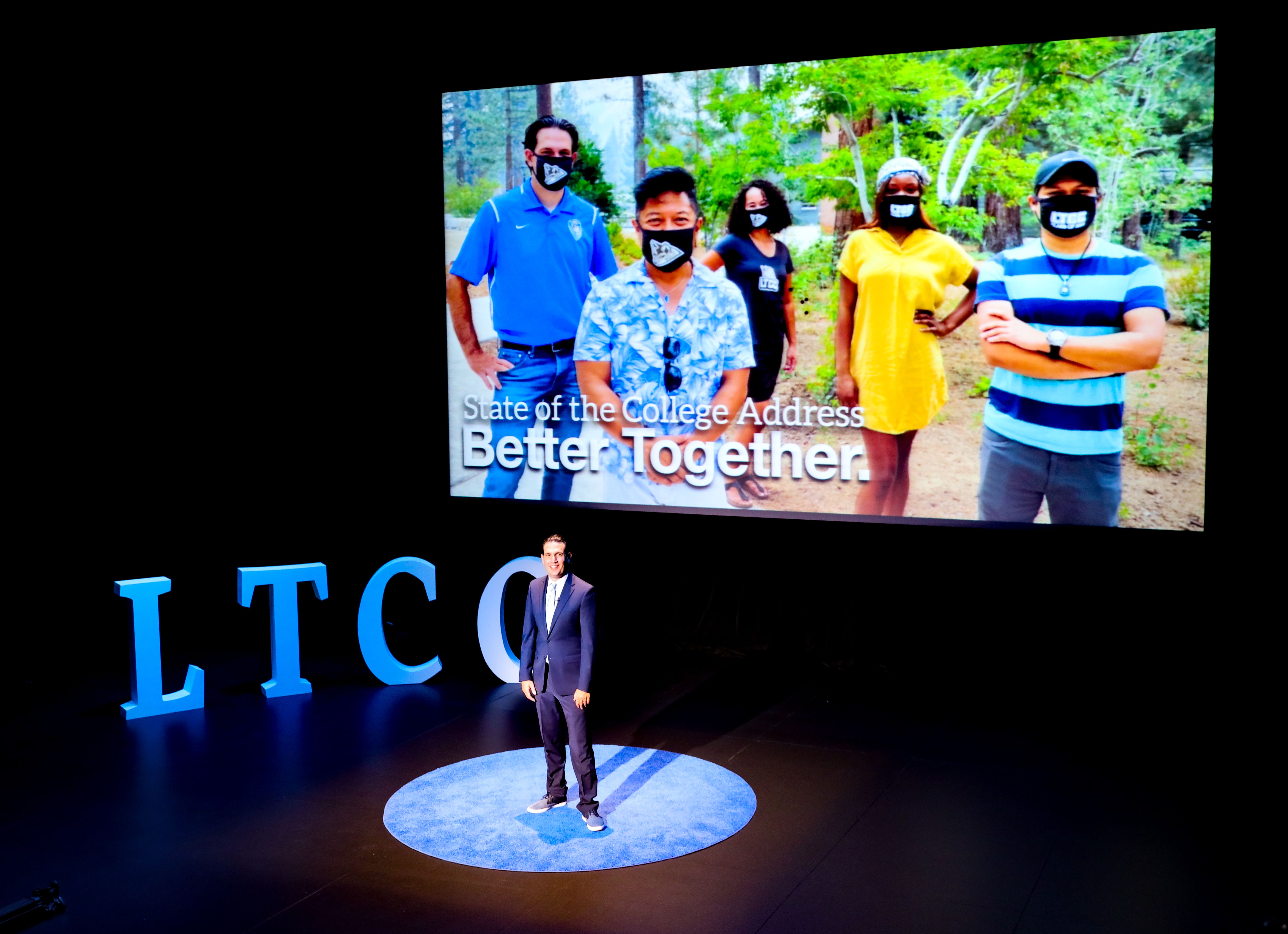 Photo of Jeff DeFranco on stage in the Duke Theatre for the State of the College address